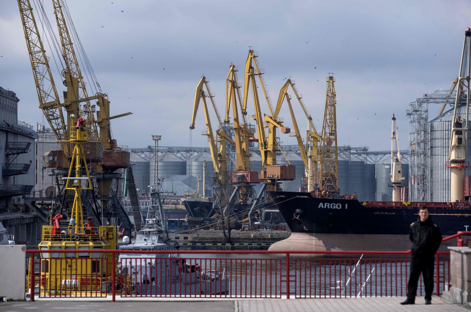 Port of Odessa with cranes, grain silos, and cargo ship